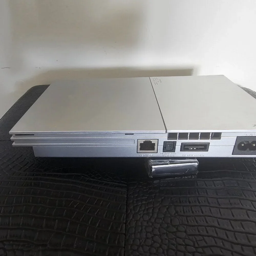 Playsation 2 (PS2 Fat) with controllers and games and PS2 Slim